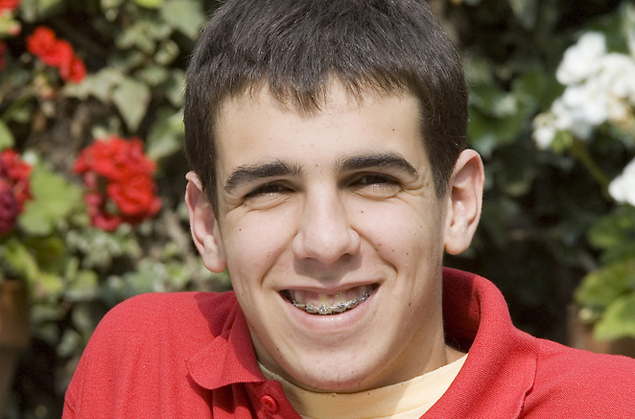 Teen with braces, smiling